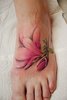 розовый цветок на ноге тату.jpg